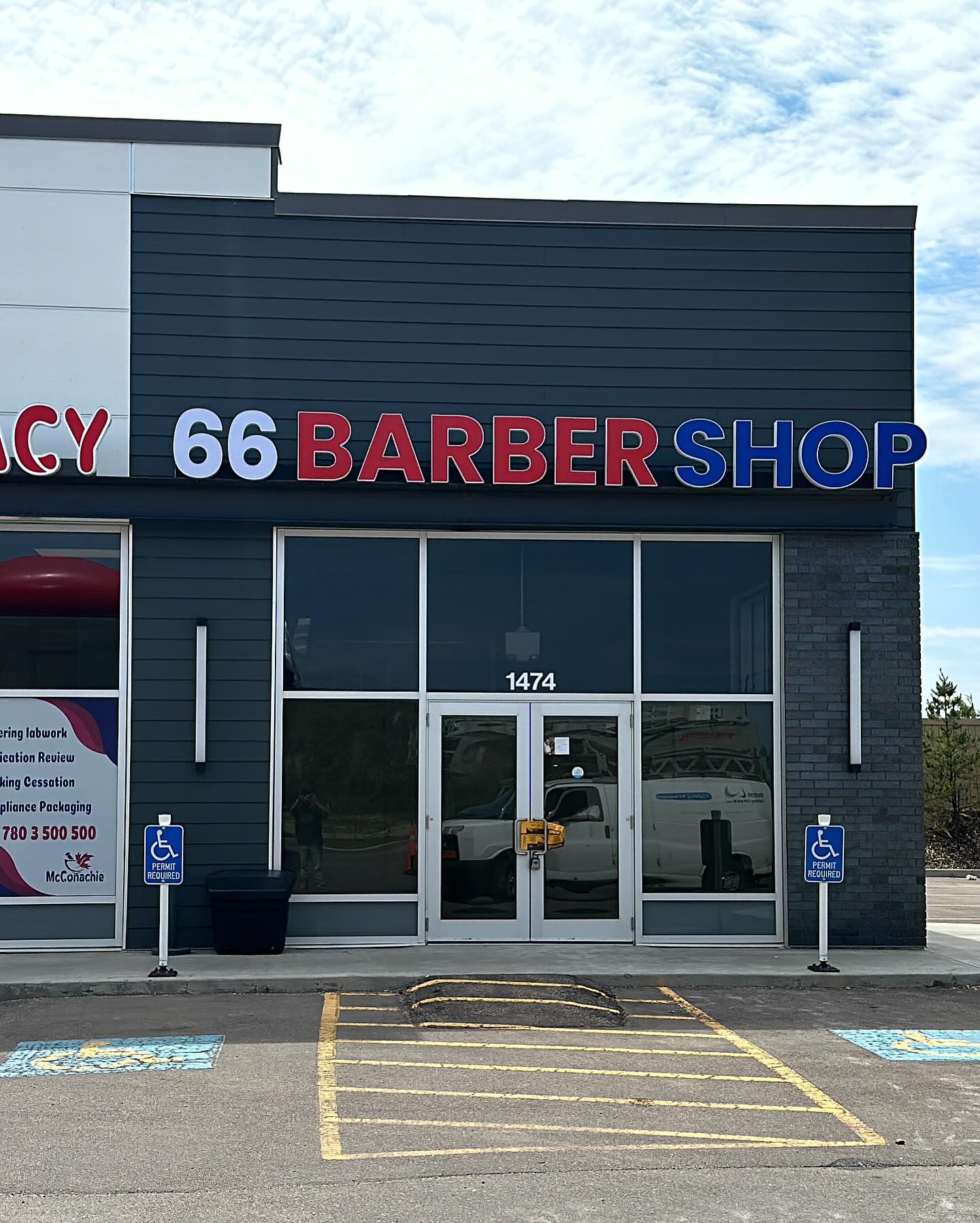 66 Barber Shop illuminated channel letters in red, white and blue