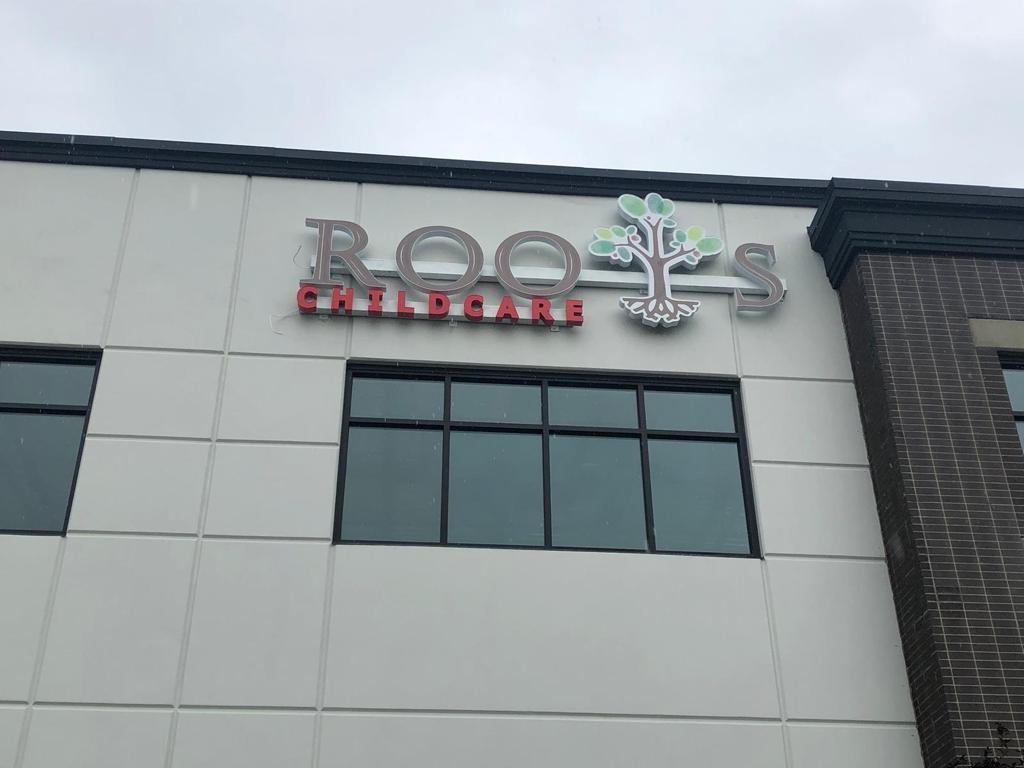 Roots Childcare illuminated channel letters with logo