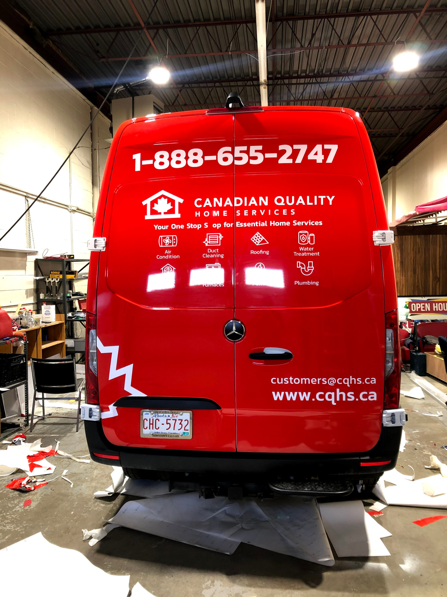 Canadian Quality Home Services red full van wrap