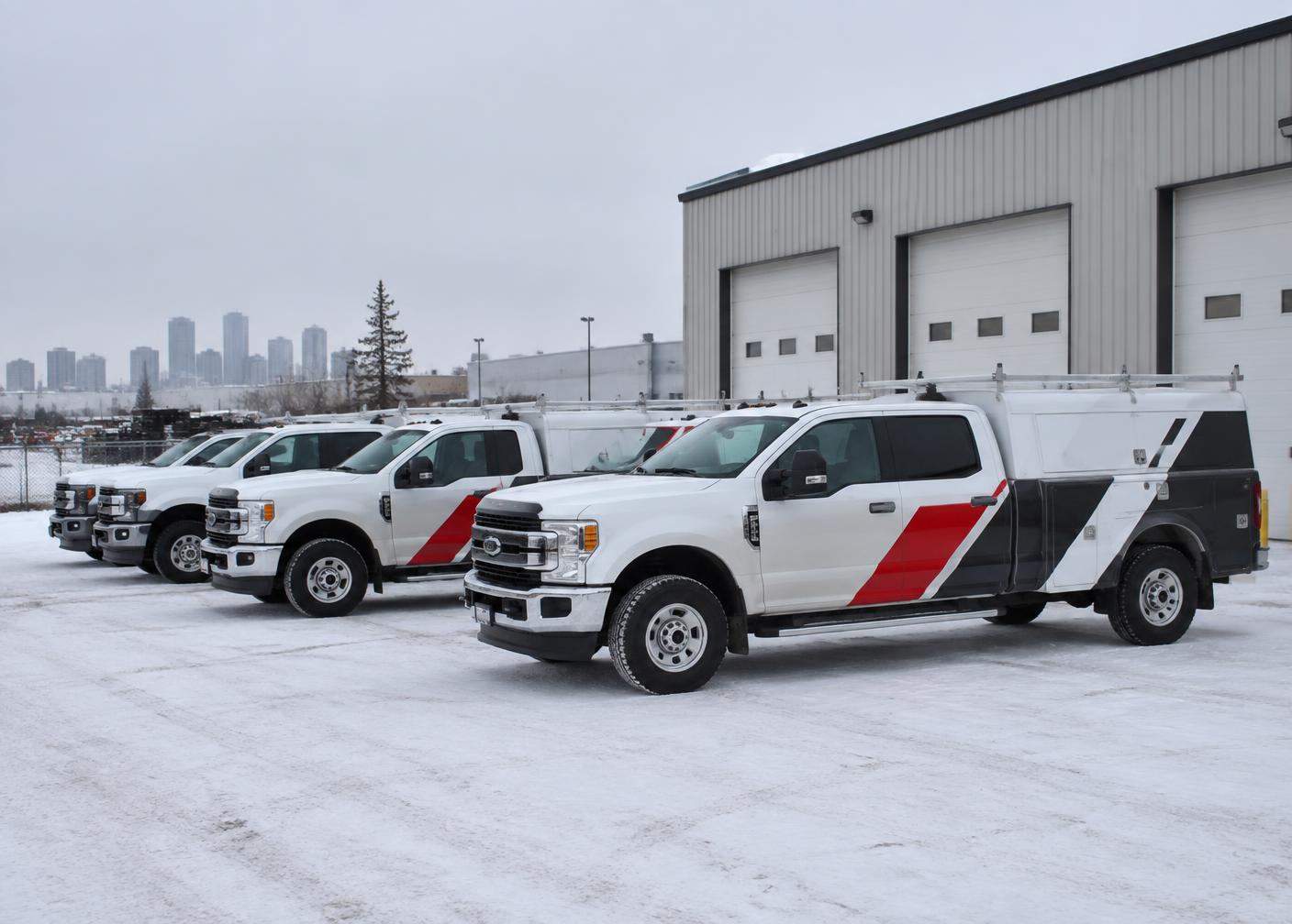 Branded service trucks outside the Edmonton shop